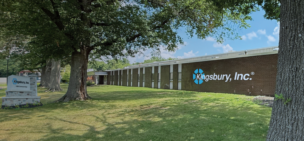 Kingsbury, Inc. building with trees and lawn